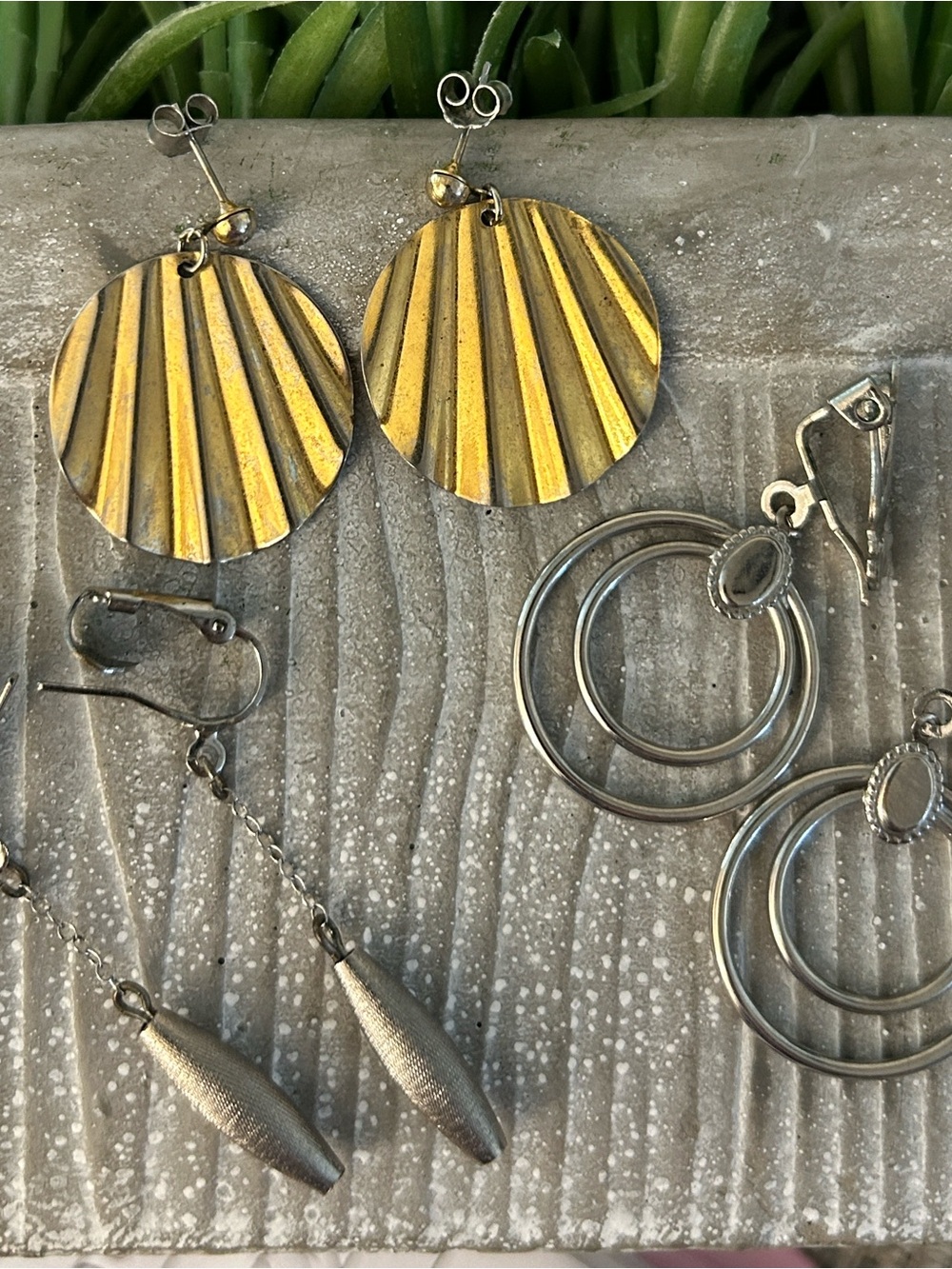 Metal earrings x3 one goldtone circular fan and 2 pair are silvertone funky fun